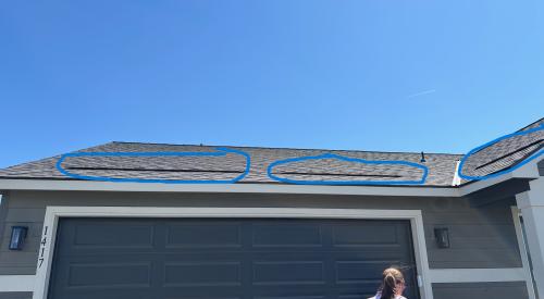 The dark horizontal lines indicated by blue circles on this roof are actually low-profile roof vents that take the place of soffit vents and are installed above the insulation level so no baffles are needed