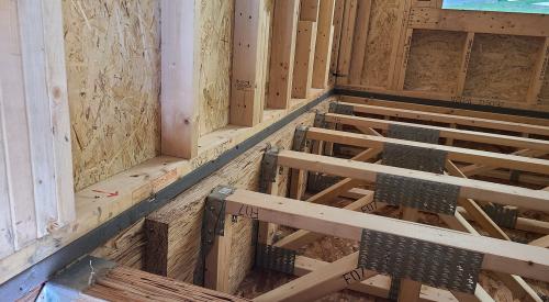 Right - A drywall gasket is installed along the top plate before installed drywall.