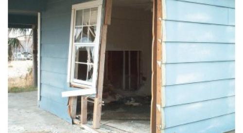 Wrong - During high winds air entered the home elsewhere and pushed out the door which was inadequately anchored to the wall.
