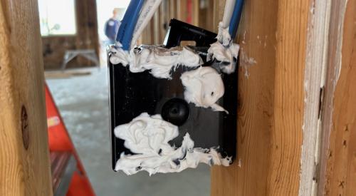 Right - Electrical boxes and wood-to-wood joints in exterior or garage-to-house walls have been caulked