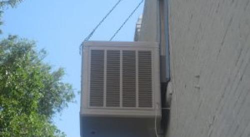 Right - This evaporative cooler is wall mounted to reduce leak effects and allow for ease of maintenance.