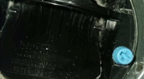 This constant airflow regulator (CAR) has been fouled by deposition of aerosolized sealant because it was not protected during duct sealing 