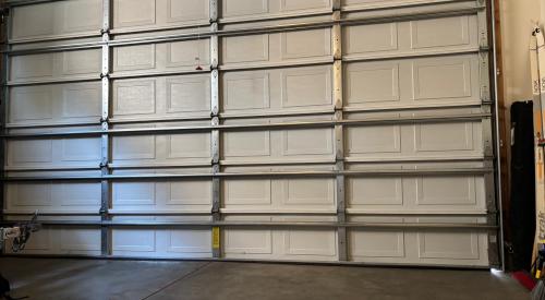 This bottom seal on this garage door looks fairly tight, except in the right corner where there is 4-inch gap.