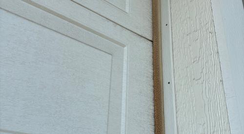 The vinyl weatherstripping along the side of this garage door has been badly weathered and needs to be replaced.