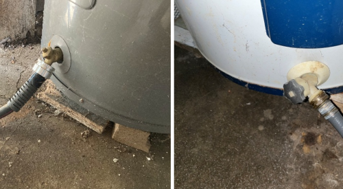 A standard garden hose is connected to the drain valve to drain the water heater tank.