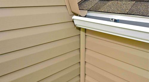 The diverter should be adequately sized to direct all of the water away from the wall and into the gutter.