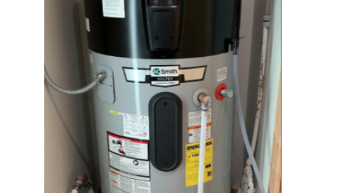 Heat pump water heater is installed in the interior closet of a multifamily dwelling unit