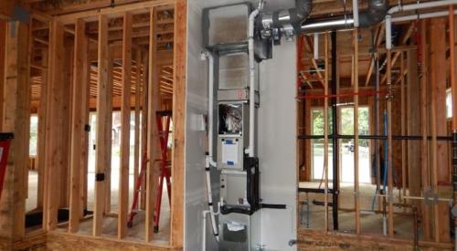 Drywall is installed both prior to and after HVAC equipment is installed to create an airtight closet away from garage pollutants.