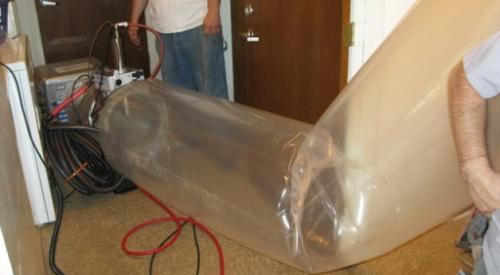 The duct sealing spray injection system application tunnel inflates as the injection system operates