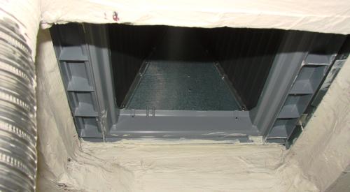 Right: The bottom of the air handler cabinet is well sealed to the return platform