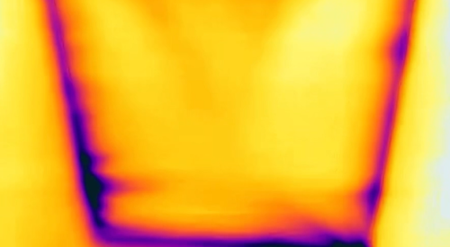 The dark purple lines and streaks around the attic access hatch and along the wall top plate in this infrared camera image indicate air leakage that could be fixed with weather stripping around the access hatch and spray foam over the top plate 