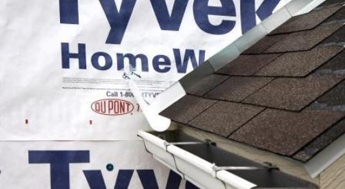 Install the house wrap. Cut house wrap to fit over diverter and tape top of cut wrap