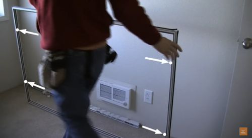 Locate the holes on the sides of the panel frame that will allow it to be screwed into place.