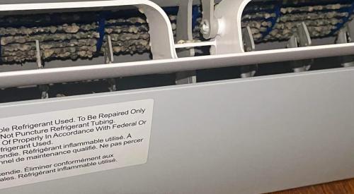 This minisplit heat pump shows a large amount of dust buildup on the blower wheel and is in need of a deep cleaning