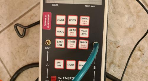 This manometer is set up to show whole house air leakage with reference to the outside during a blower door test; the reading is showing 1,434 cfm of leakage when the home is depressurized to about 50 Pascals. 