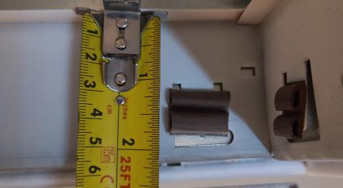 Measure the air filter space in the return grille of the HVAC system to determine the thickest air filter the space will accommodate, in this case two inches.