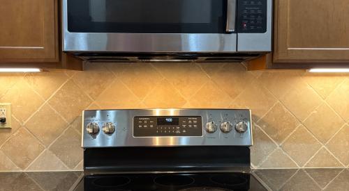 This microwave oven is located over the stove and has an exhaust fan underneath it