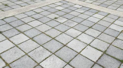 Porous surfaces like pavers allow water to pass through and percolate slowly into the soil 