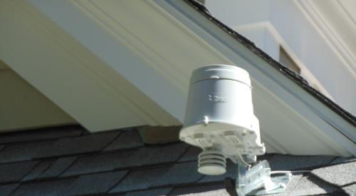 Right - A moisture sensor is installed on the roof to control the sprinkler system.