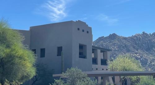 Right – thermal mass walls, small windows, and recessed porch and trees on the south side of this southwest home help to minimize solar heat gain.