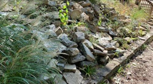 Riprap is placed on a hillside to stabilize the ground and reduce erosion