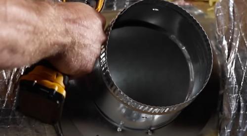 This take-off collar for a round metal duct is secured to the HVAC plenum using #7 x ½-inch self-piercing/self-drilling sheet metal screws.