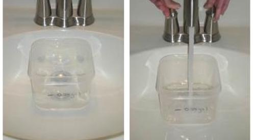 Testing the flow rate of a bathroom sink faucet.