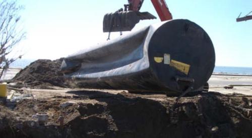 This gasoline tank collapsed due to pressure from flood waters during Hurricane Katrina, 2005, Biloxi, MS.