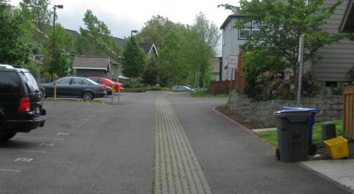 The developer added pavers and drains that discharge to underground drywells to reduce storm water runoff.