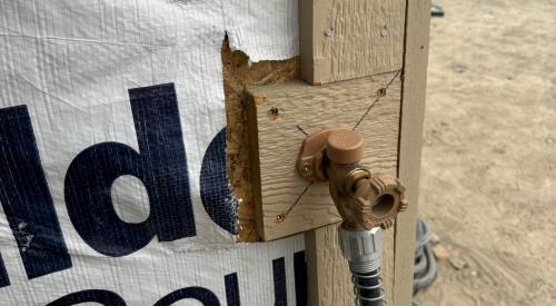 Wrong - House wrap was not cut installed under the plumbing hose bib trim and/or edges of the house wrap have not been taped so sheathing is exposed.