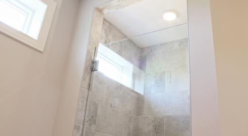 Right – This bath fan runs continuously at low speed and is activated by a motion sensor to operate a higher speeds.