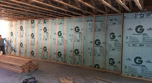 Right - The poured concrete basement walls are insulated along the inside with 2.5 inches of extruded polystyrene insulation.