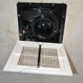 Opening the outlet on a bath fan reveals model information and provides access to the motor