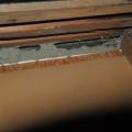 This kneewall has no top plate and the resulting gap provides a wide-open pathway for air and vapor to travel between the living space and the attic