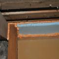 The missing top plate in a kneewall was covered with lumber and rigid foam insulation and then sealed with spray foam
