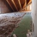 Right - R-100 of blown cellulose covers the floor and rafters of this attic.