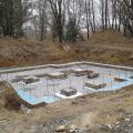 The blue foam sill gasket visible on the foundation wall will help ensure an air-tight connection with the double-wall assembly above.