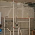 The sump pumps in this basement are covered with gasketed lids to keep soil gases out of the home.