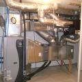 Right - An ultra-efficient (COP 5.7) ground source heat pump provides hot water to an air coil in the central air handler which uses a variable-speed electrically commutated fan motor to distribute conditioned air to the home’s ducts.