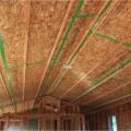 The builder installed this OSB under the roof rafters and air sealed the seams with tape then added a dropped drywall ceiling to provide a service cavity for ducts and wiring, while minimizing holes into the attic.