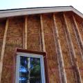 The exterior walls of this home consist of two wall cavities: a 2x6 wall with plywood sheathing plus 8-inch I-joists sheathed with engineered wood; both cavities are dense-packed with cellulose for R-60 total. 