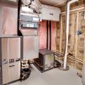 The ultra-efficient ground source heat pump (COP 4.4) delivers conditioned air throughout the home via ducts; an ERV provides fresh air to the system.