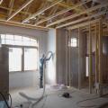 After spraying the 2x6 wall cavities with 2 inches (R-13) of closed-cell spray foam, the walls are covered with netting and an additional 3.5 inches of fiberglass (R-13) is blown in. 