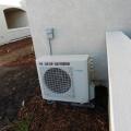 The ultra-efficient air-to-water heat pump draws heat from the outside air to heat inside room air in winter and domestic hot water year-round.