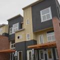 The black coating on these walls is a liquid-applied asphalt-based air and moisture barrier.
