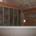 Extra-wide air sealing tape seals seam where the structural insulated panels (SIPs) that form the roof and walls meet. 