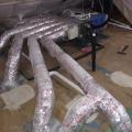 This ducted mini-split heat pump was installed in the unvented, conditioned attic and ducted with short duct runs to several nearby rooms.