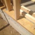 The 2x4 wall studs are staggered along the 2x6 sill plate providing space to weave insulation around each stud to stop thermal bridging through the wall.