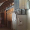 Right - A heat recovery ventilator supplies all living spaces with fresh air while transferring heat for energy savings.