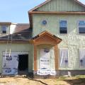 The builder installed 1.5 inches of soy-based spray foam on the outside of the walls over the OSB sheathing, then kept a ¾ inch gap between the foam and the brick veneer siding to allow moisture vapor from the bricks to dissipate.